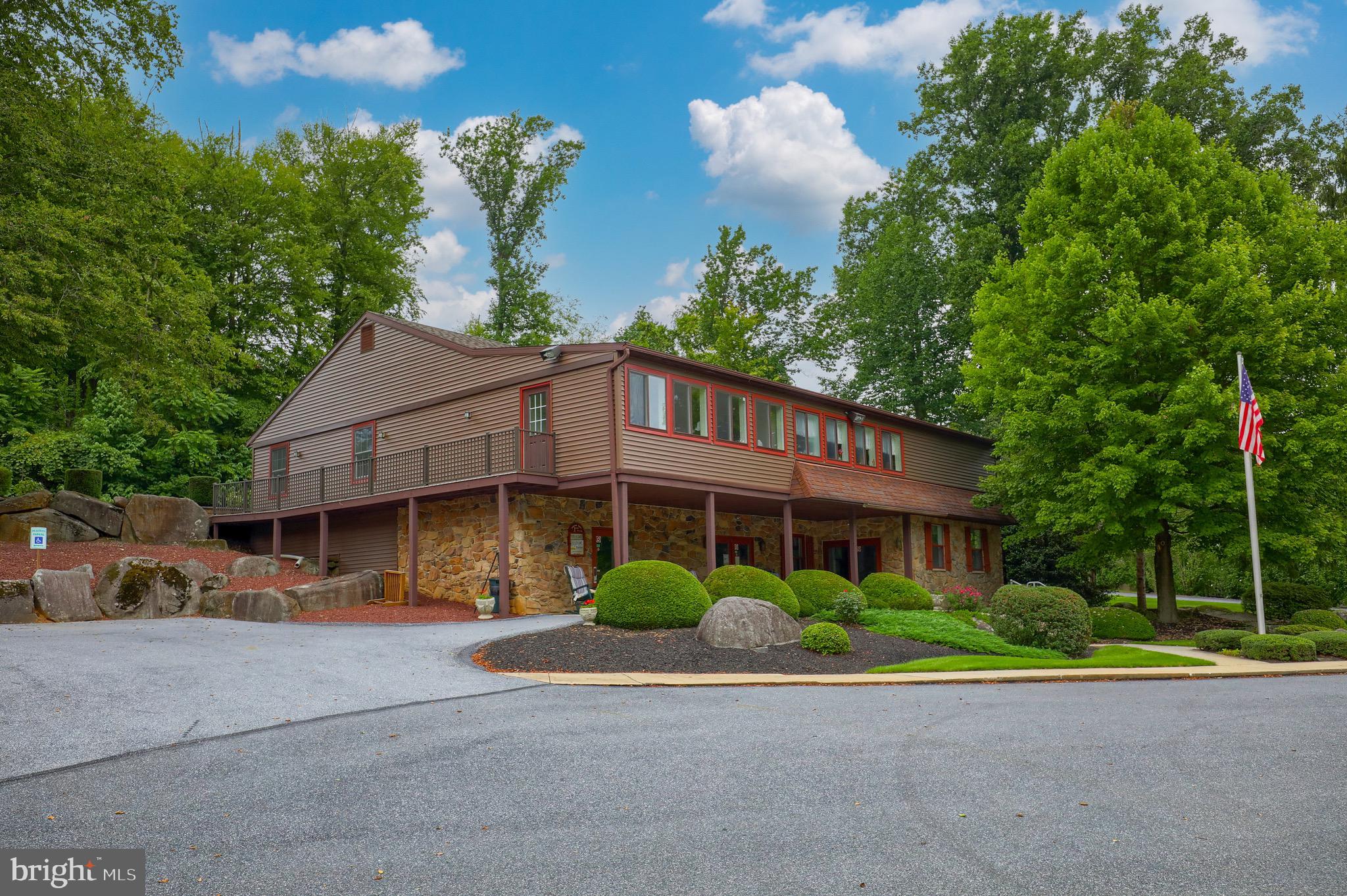 109 Maple Avenue Manheim, PA 17545 - Photo 37 of 39 a front view of a house with a yard and garage