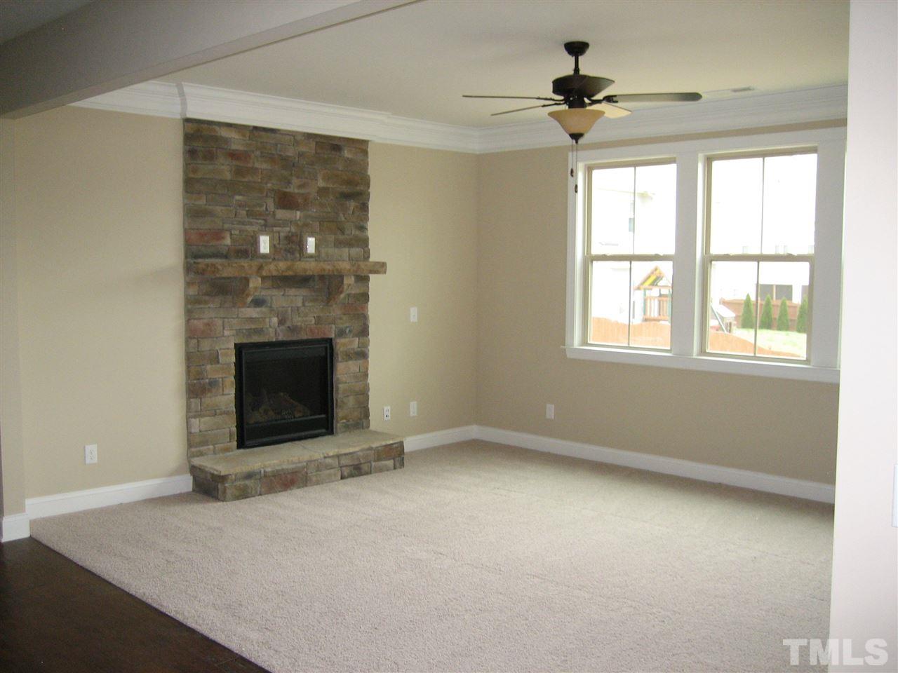 3605 Greenville Loop Road Wake Forest, NC 27587 - Photo 11 of 25 Opens to Kitchen - Stone fireplace