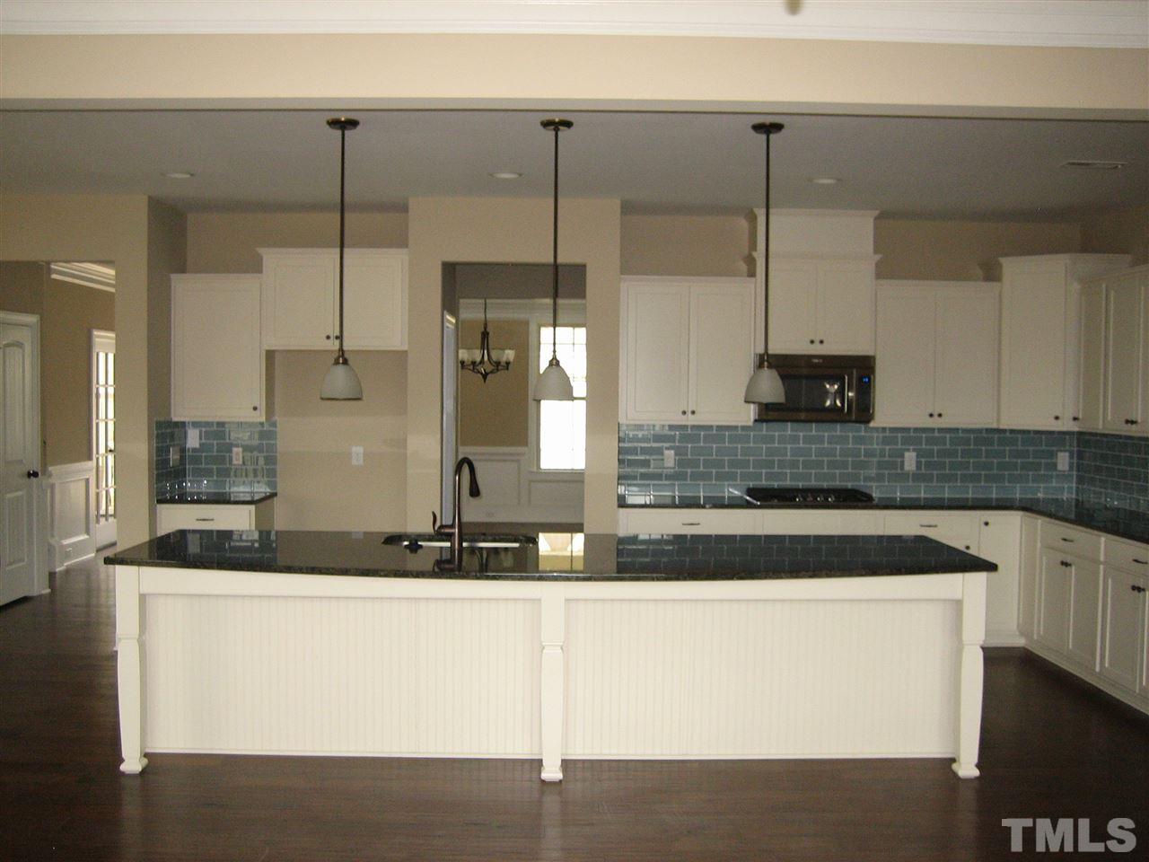 3605 Greenville Loop Road Wake Forest, NC 27587 - Photo 7 of 25 Kitchen - Opens to Family and Breakfast - Huge 12' Island