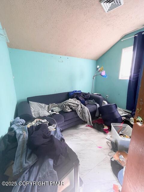 139 Mountain Top Circle Bushkill, PA 18324 - Photo 16 of 21 a bed sitting in a room next to a lamp