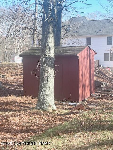 139 Mountain Top Circle Bushkill, PA 18324 - Photo 6 of 21 a view of a wooden house with a large tree