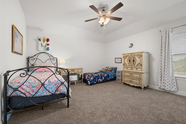 a bedroom with furniture and a chandelier