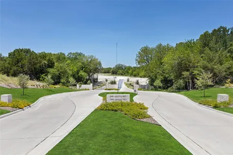 a view of a swimming pool with a yard