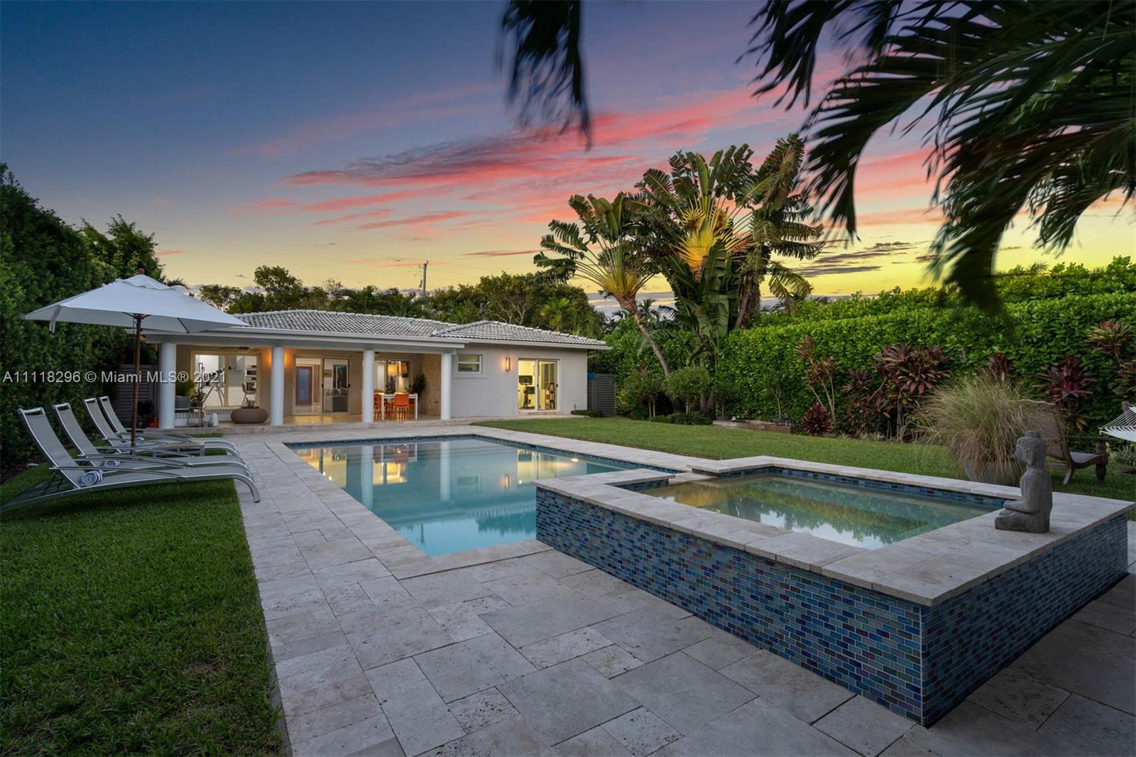 a front view of house with yard and outdoor seating