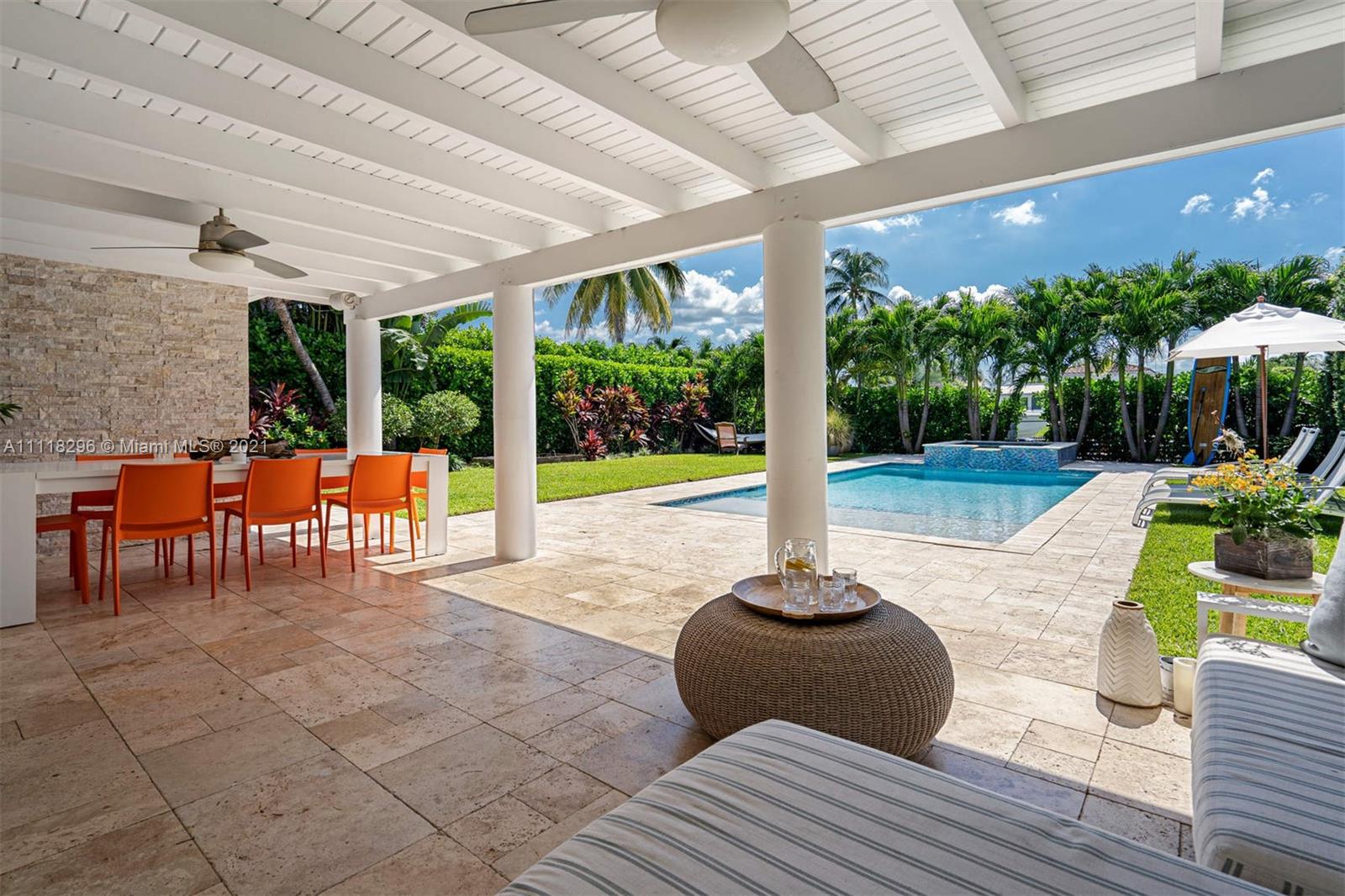 1690 Cleveland Road Miami Beach, FL 33141 - Photo 13 of 29 a view of a patio with table and chairs potted plants with wooden floor and fence