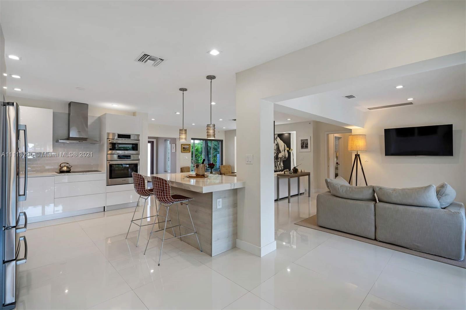 1690 Cleveland Road Miami Beach, FL 33141 - Photo 18 of 29 a living room with furniture and a flat screen tv