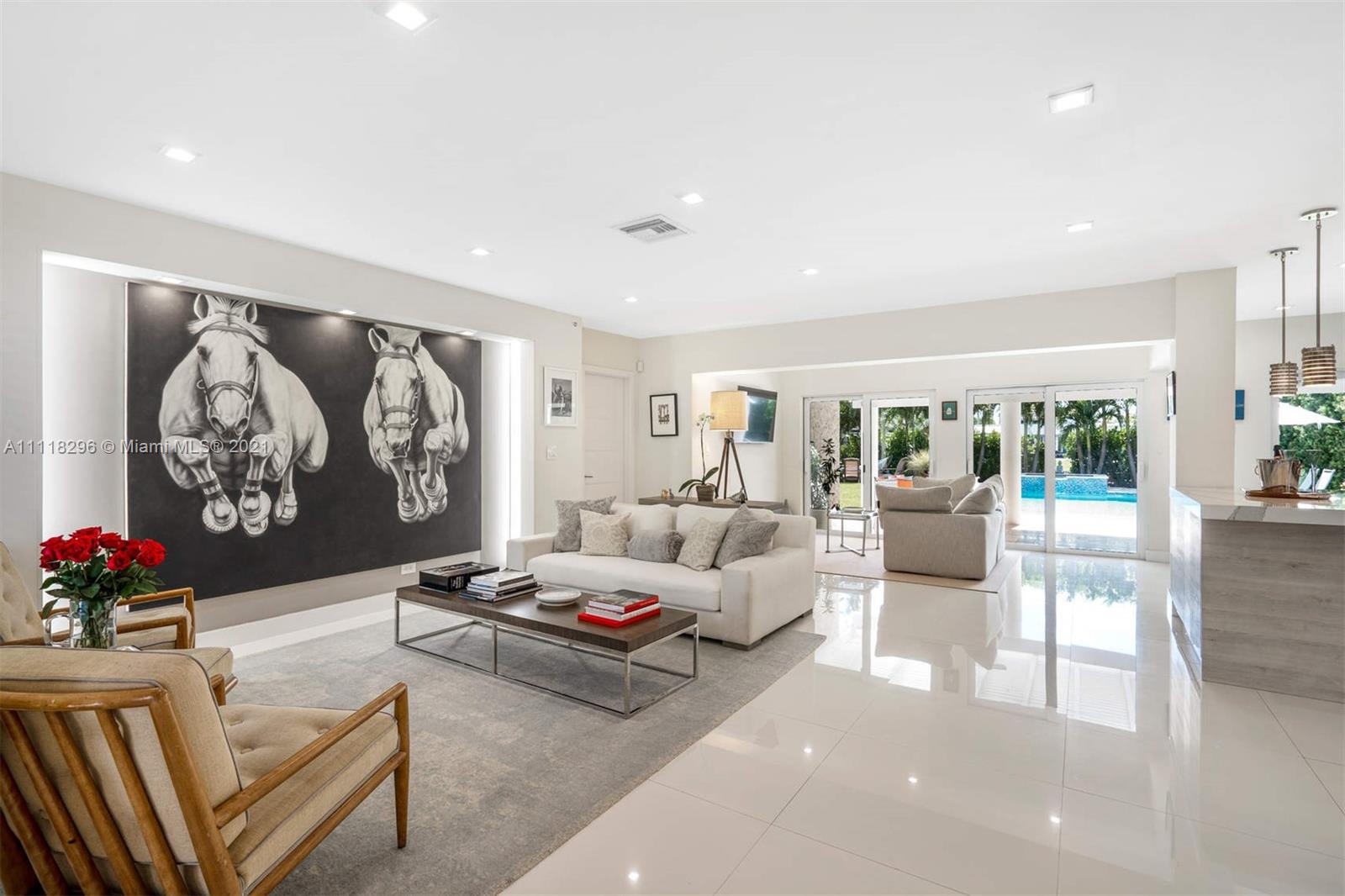 1690 Cleveland Road Miami Beach, FL 33141 - Photo 3 of 29 a living room with furniture and a potted plant