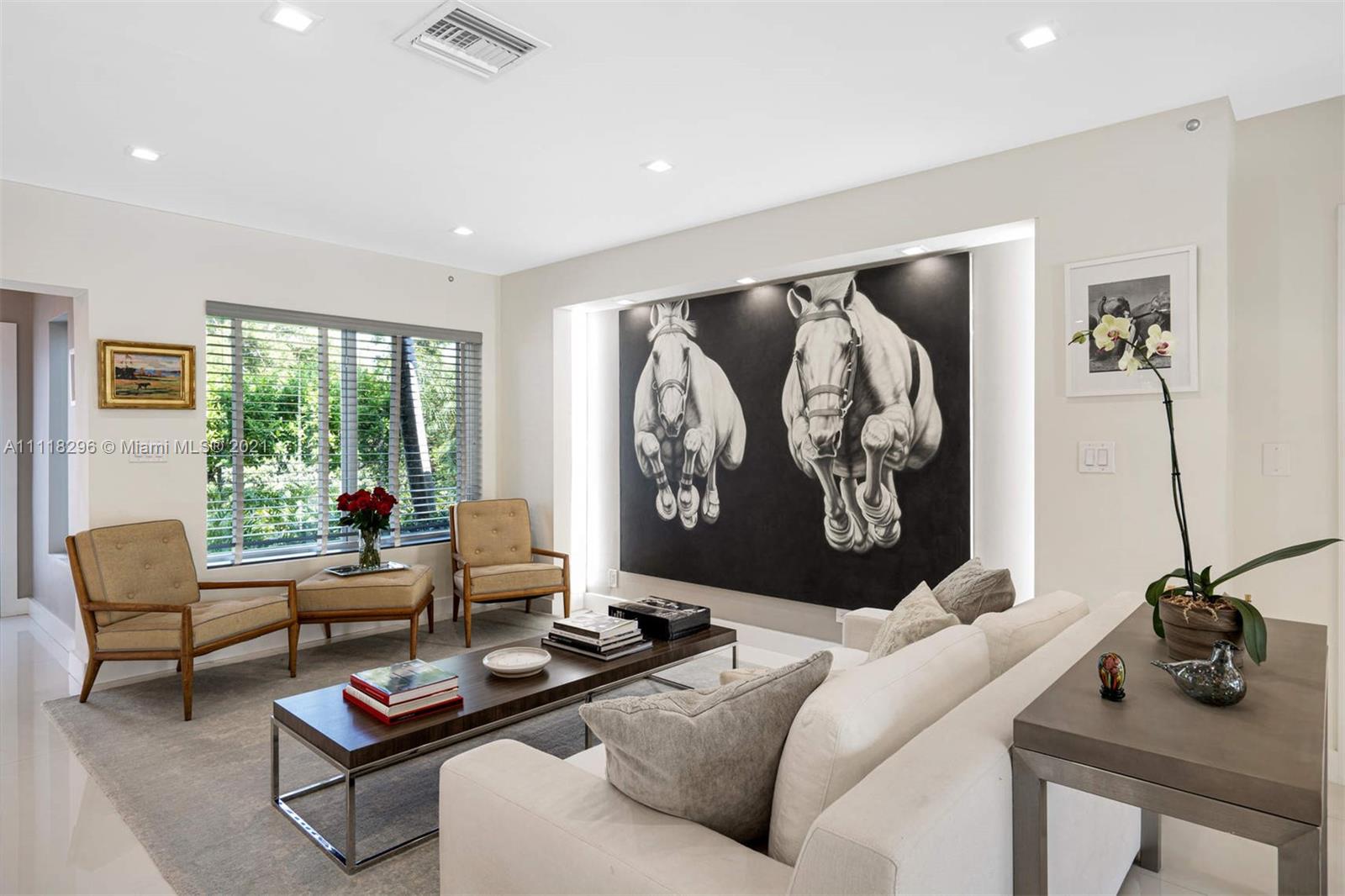 1690 Cleveland Road Miami Beach, FL 33141 - Photo 8 of 29 a living room with furniture a rug and a large window