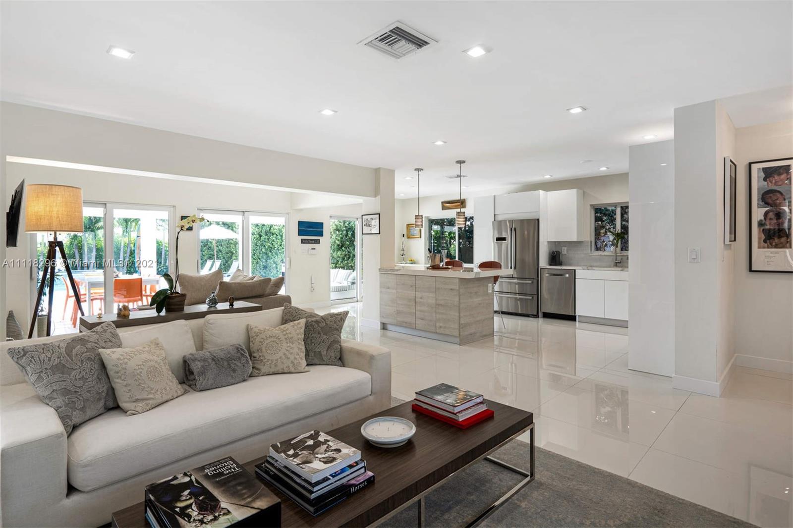 1690 Cleveland Road Miami Beach, FL 33141 - Photo 9 of 29 a living room with furniture and a large window