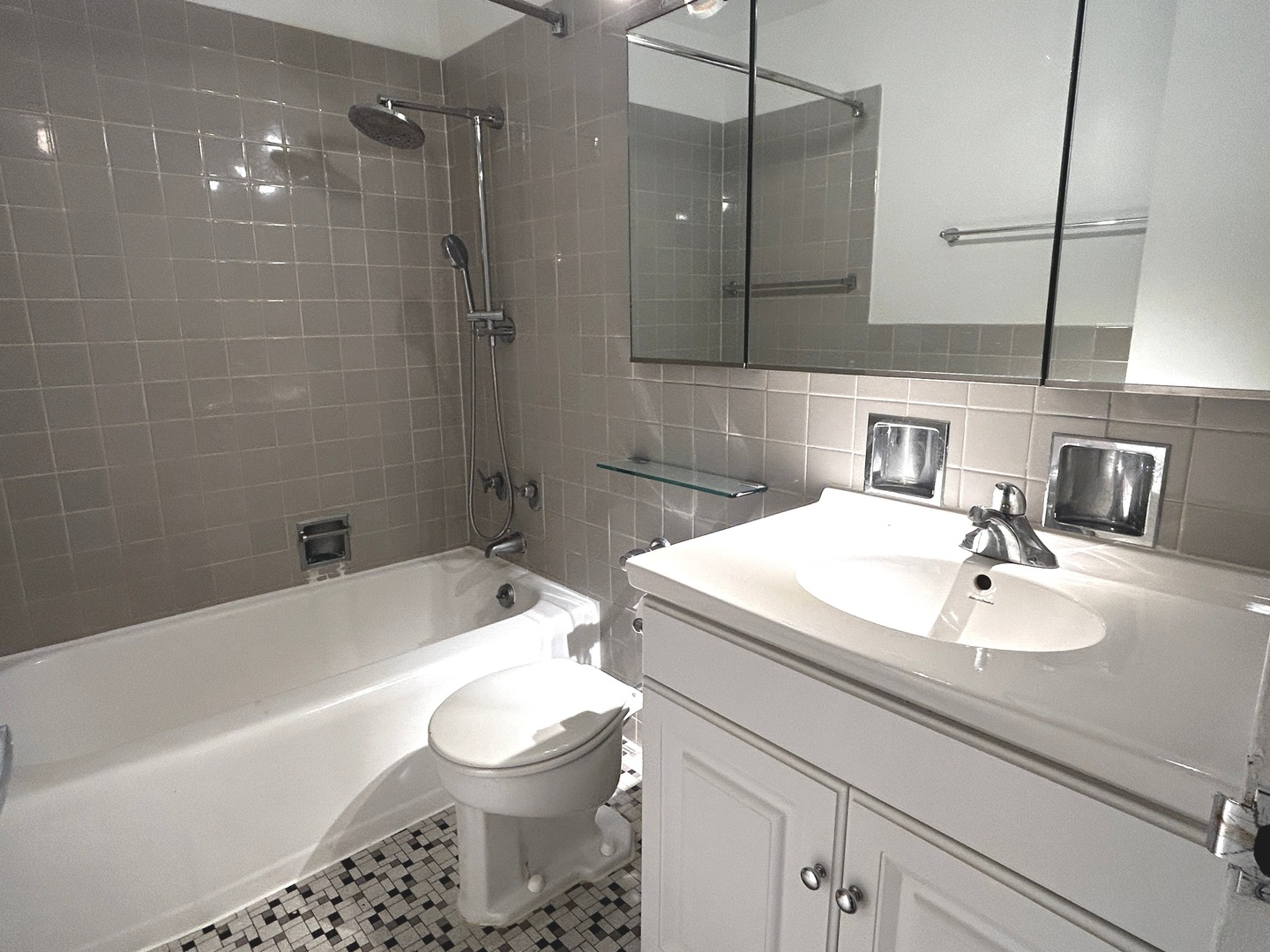 860 North Dewitt Place, Unit 804 Chicago, IL 60611 - Photo 5 of 11 a bathroom with a sink toilet vanity and bathtub