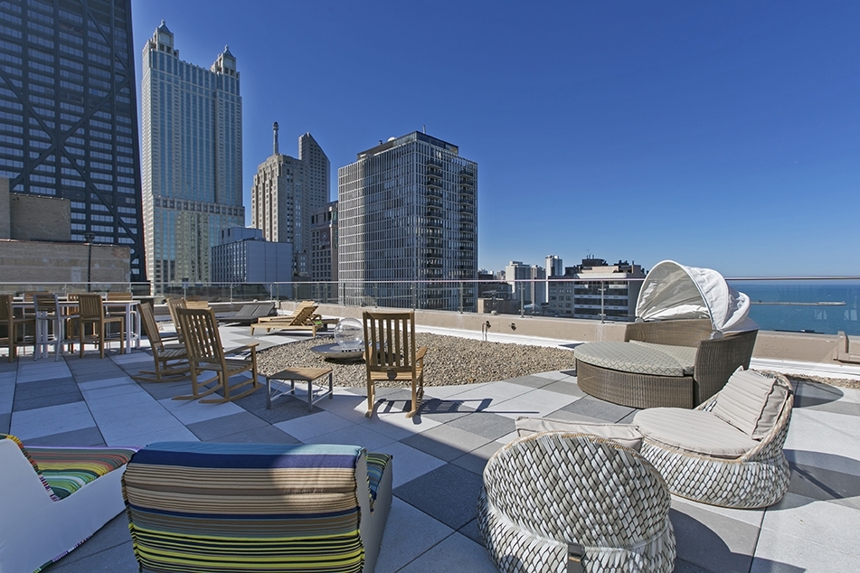 860 North Dewitt Place, Unit 804 Chicago, IL 60611 - Photo 8 of 11 a view of roof deck with couch and chairs