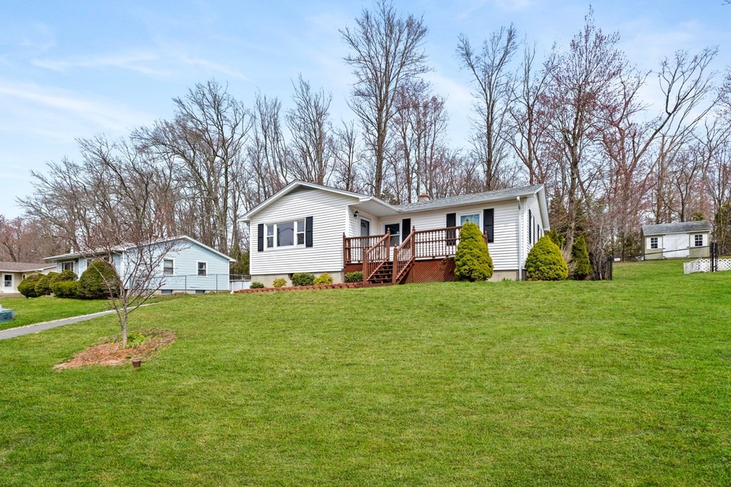 151 Garnet Street Springfield, MA 01129 - Photo 1 of 41 a front view of a house with a yard