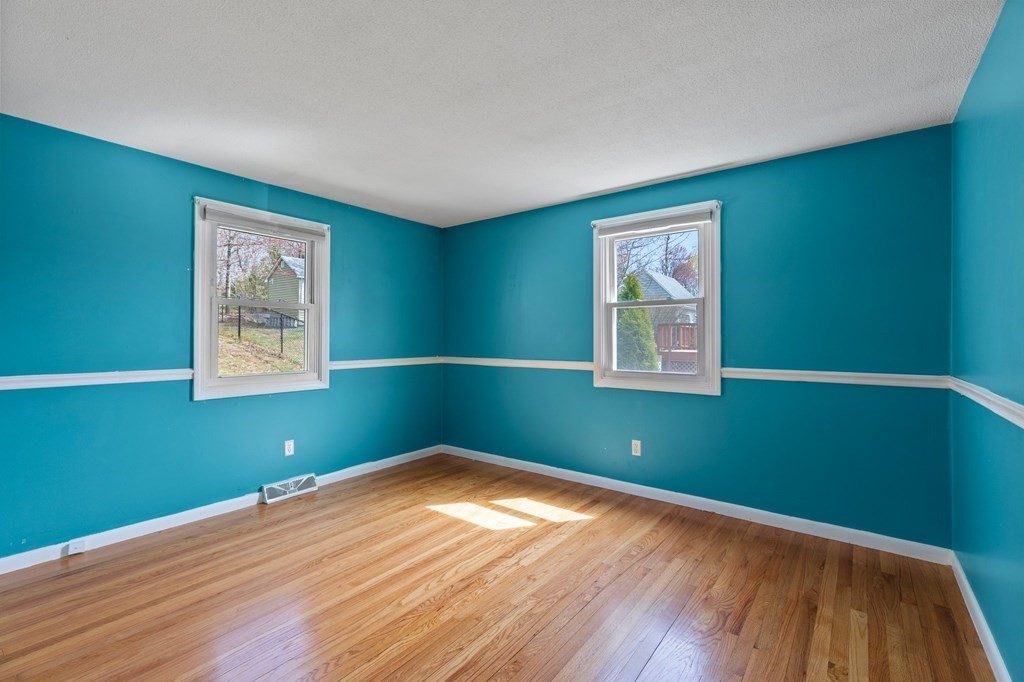 151 Garnet Street Springfield, MA 01129 - Photo 19 of 41 a room with window and wooden floor