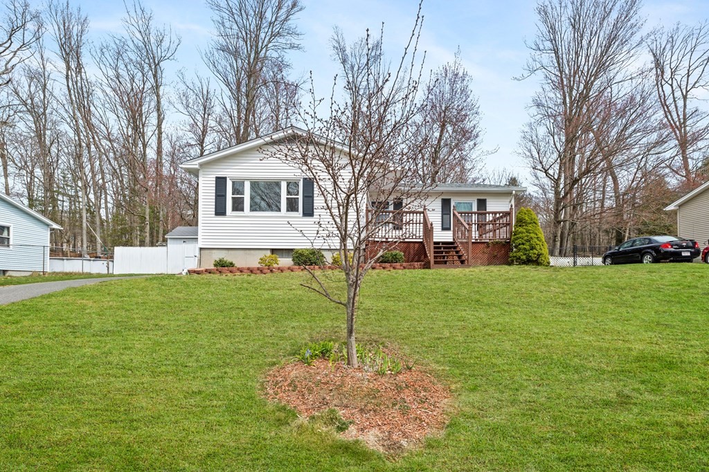 151 Garnet Street Springfield, MA 01129 - Photo 2 of 41 a house view with a garden space
