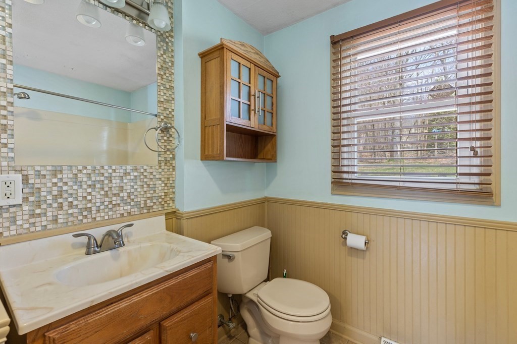 151 Garnet Street Springfield, MA 01129 - Photo 26 of 41 a bathroom with a sink a toilet and a window