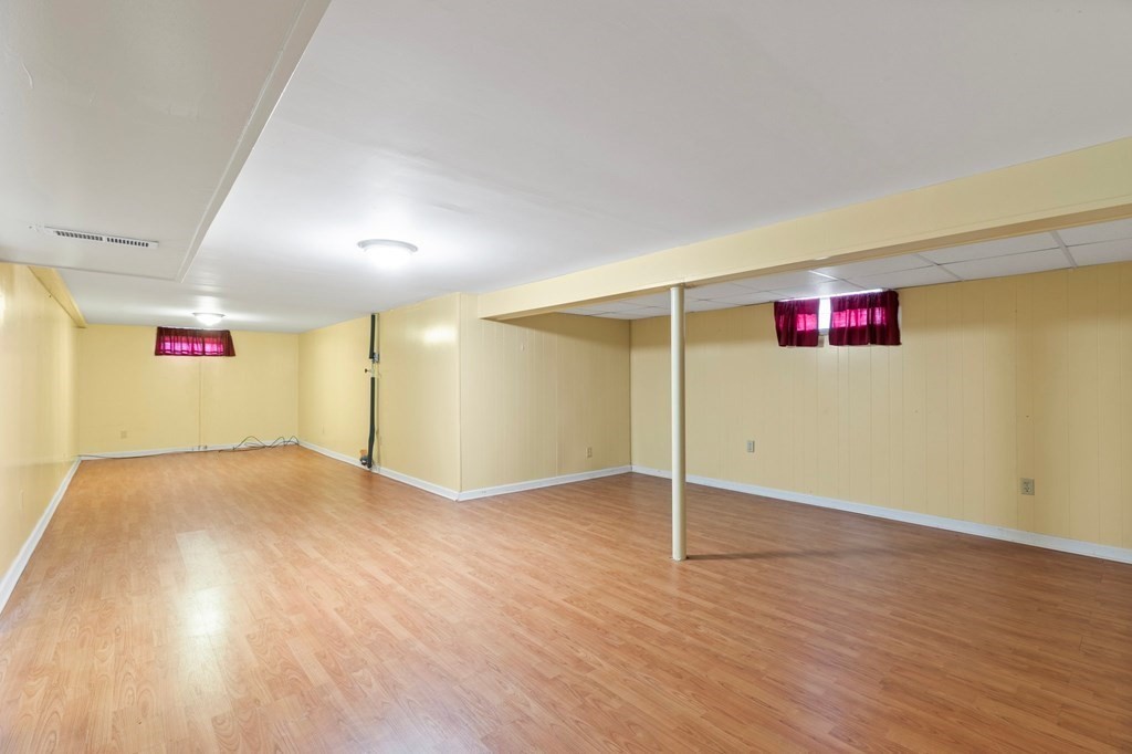 151 Garnet Street Springfield, MA 01129 - Photo 27 of 41 an empty room with wooden floor and windows