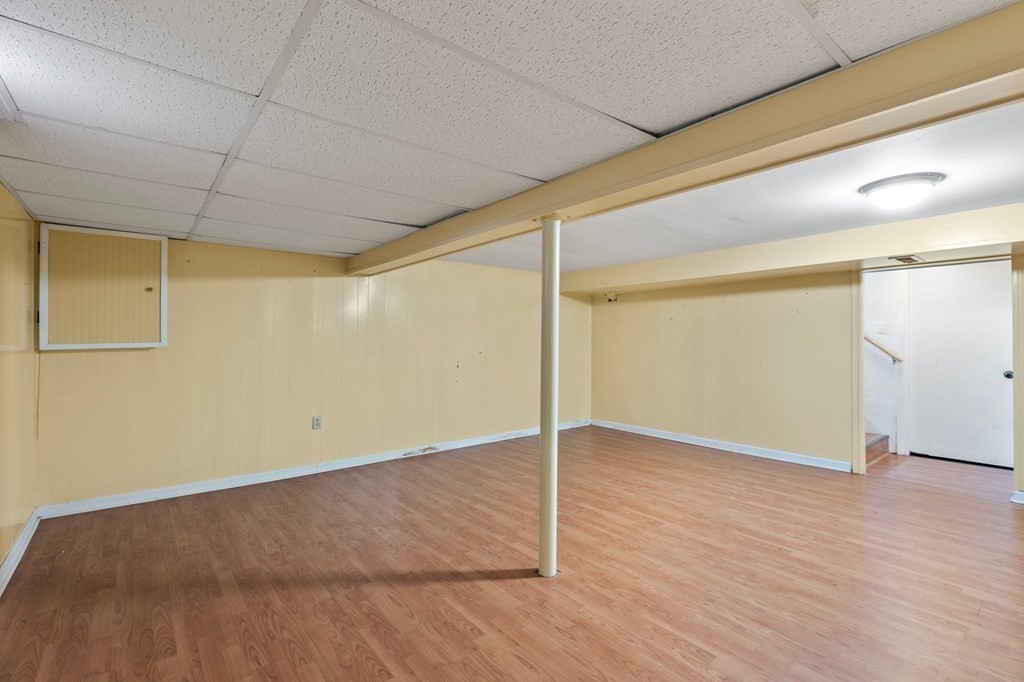 151 Garnet Street Springfield, MA 01129 - Photo 29 of 41 an empty room with wooden floor and door