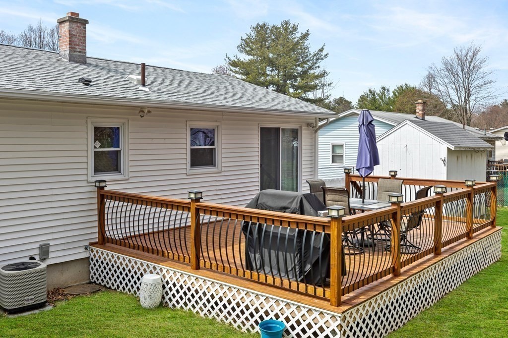 151 Garnet Street Springfield, MA 01129 - Photo 36 of 41 a view of a roof deck with wooden fence and trees