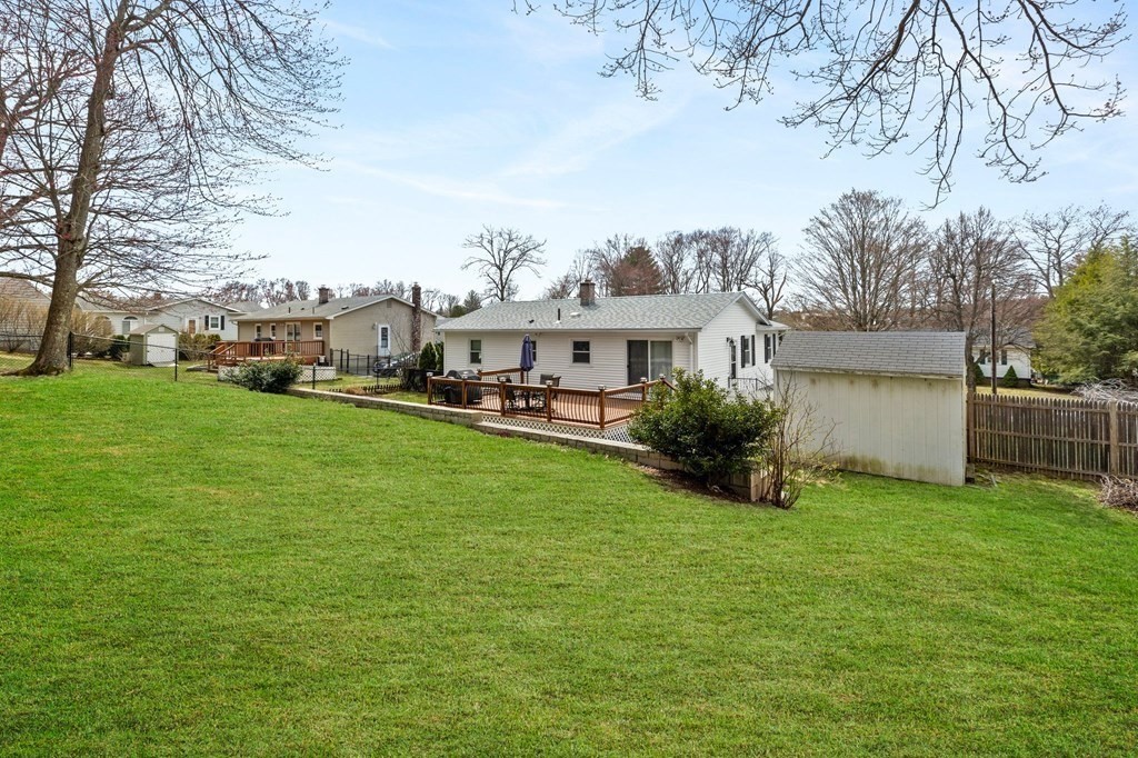 151 Garnet Street Springfield, MA 01129 - Photo 39 of 41 a view of a house with a big yard and large trees