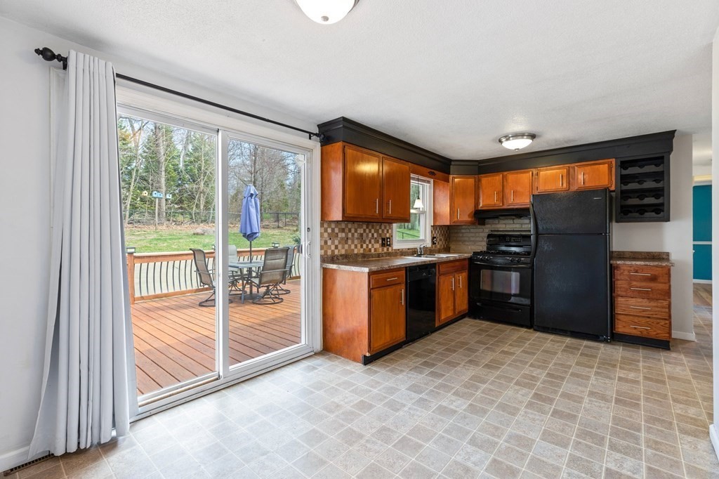 151 Garnet Street Springfield, MA 01129 - Photo 7 of 41 a kitchen with stainless steel appliances granite countertop a refrigerator and a sink