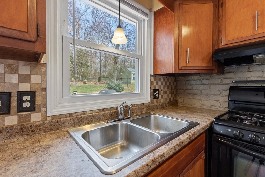 151 Garnet Street Springfield, MA 01129 - Photo 10 of 41 a kitchen that has a sink and a stove