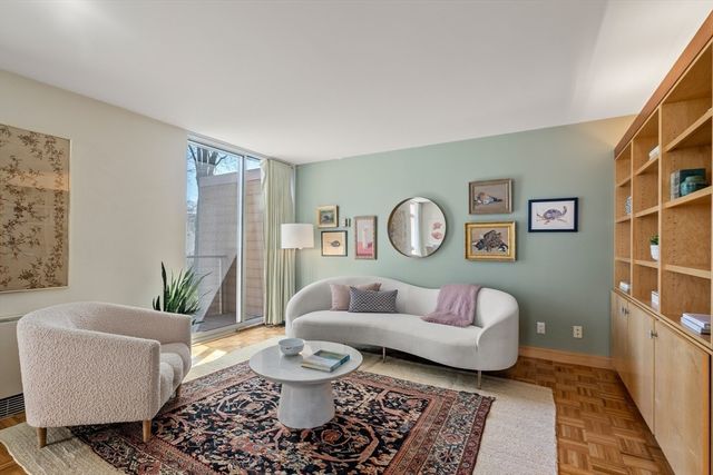 a living room with furniture and a rug