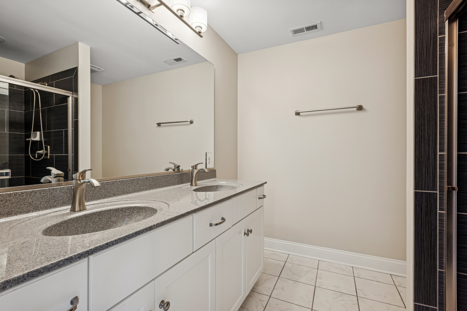 57 South 7th Street Geneva, IL 60134 - Photo 15 of 24 a bathroom with a granite countertop sink and a mirror