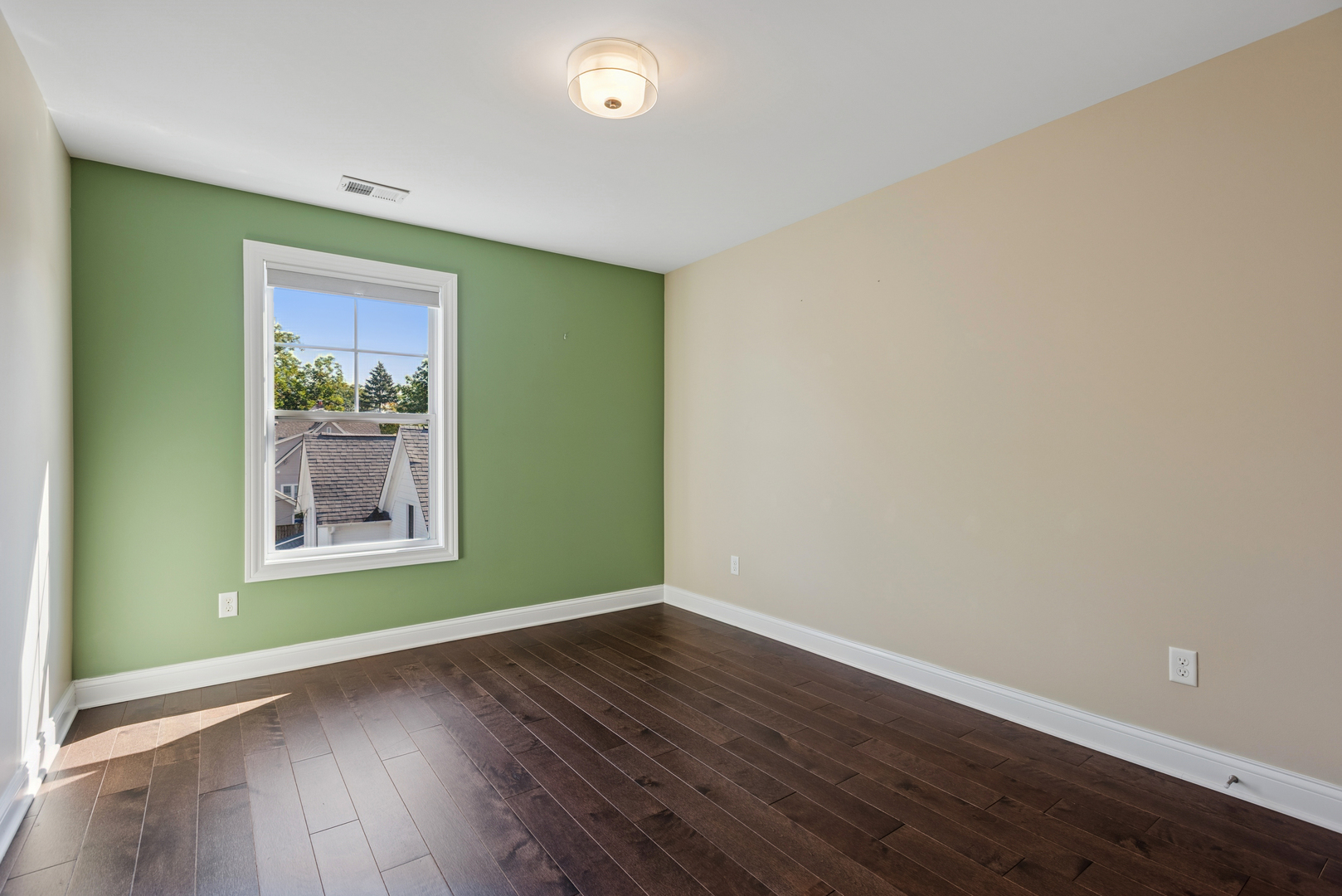 57 South 7th Street Geneva, IL 60134 - Photo 17 of 24 an empty room with wooden floor and a window