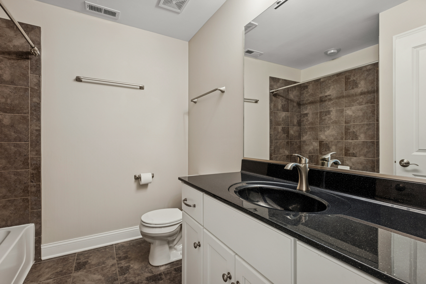57 South 7th Street Geneva, IL 60134 - Photo 19 of 24 a bathroom with a sink and a toilet
