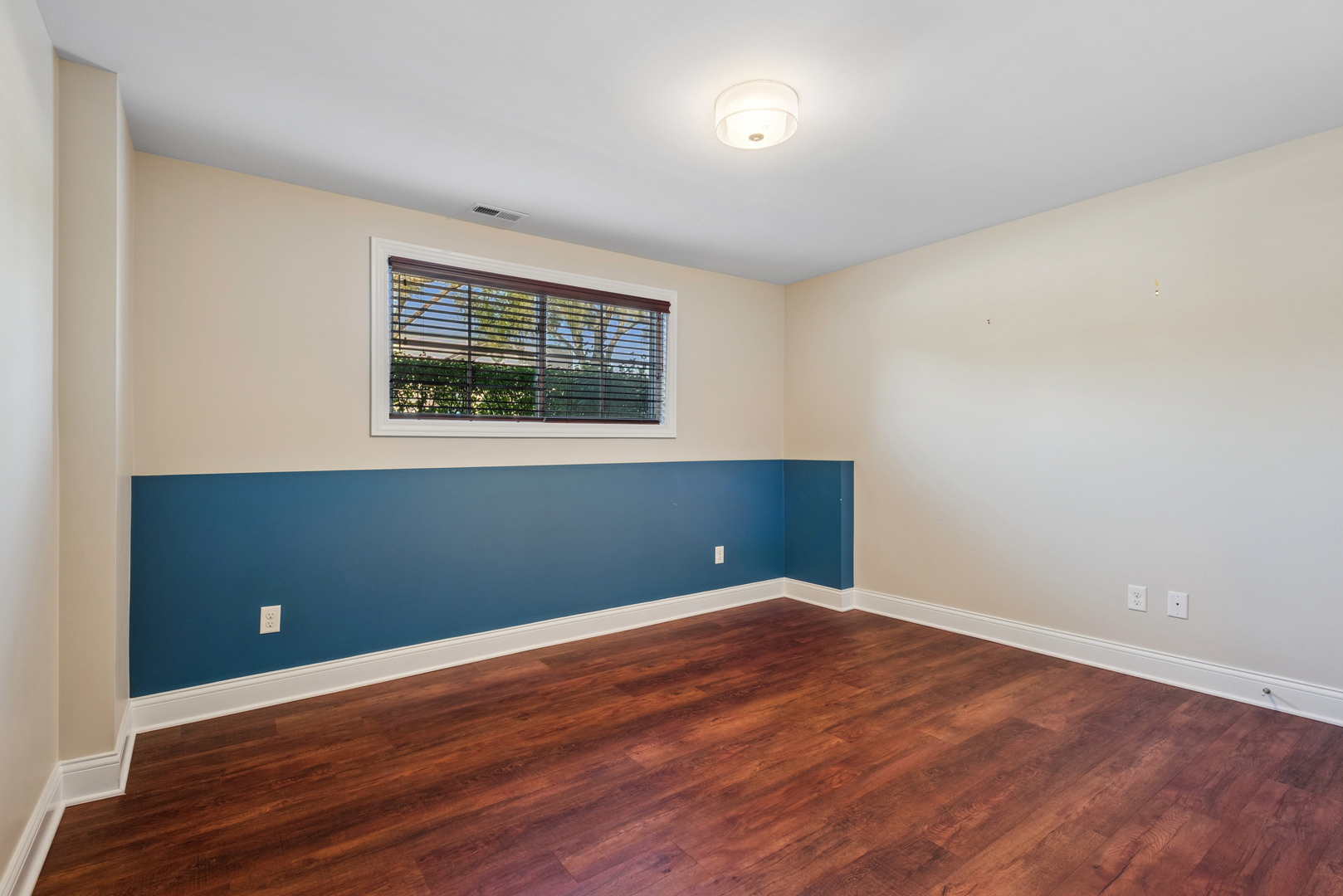 57 South 7th Street Geneva, IL 60134 - Photo 20 of 24 a view of an empty room with wooden floor and a window