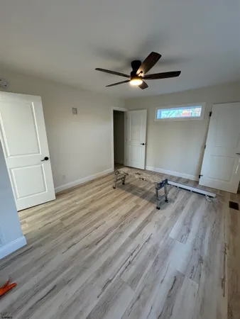 a view of a room with a flat screen tv