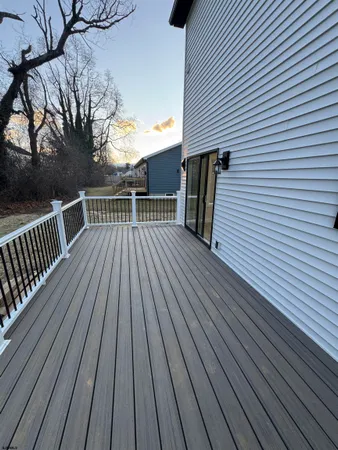 a view of backyard with a deck