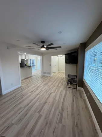 a view of work space with wooden floor and furniture