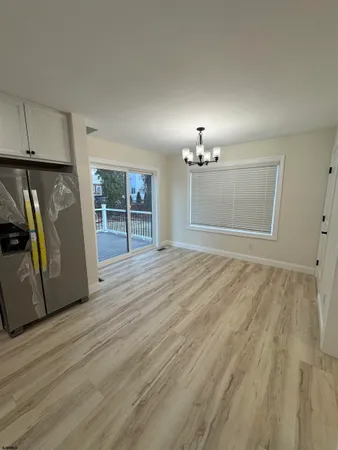 a view of a livingroom with wooden floor