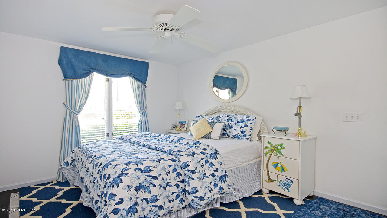 5 Solana Road Ponte Vedra Beach, FL 32082 - Photo 20 of 28 a bedroom with a bed and a window