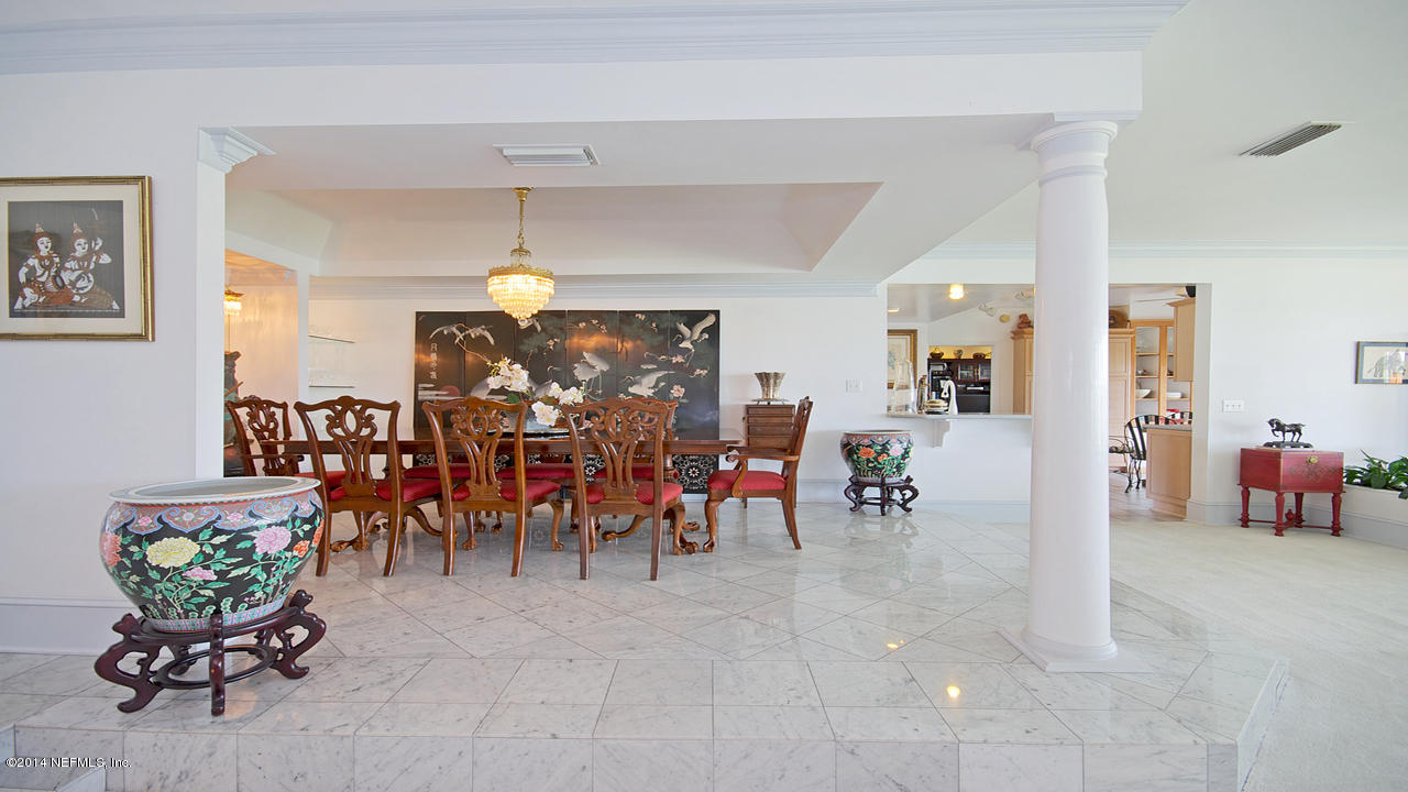 5 Solana Road Ponte Vedra Beach, FL 32082 - Photo 3 of 28 a living room filled with furniture and a chandelier