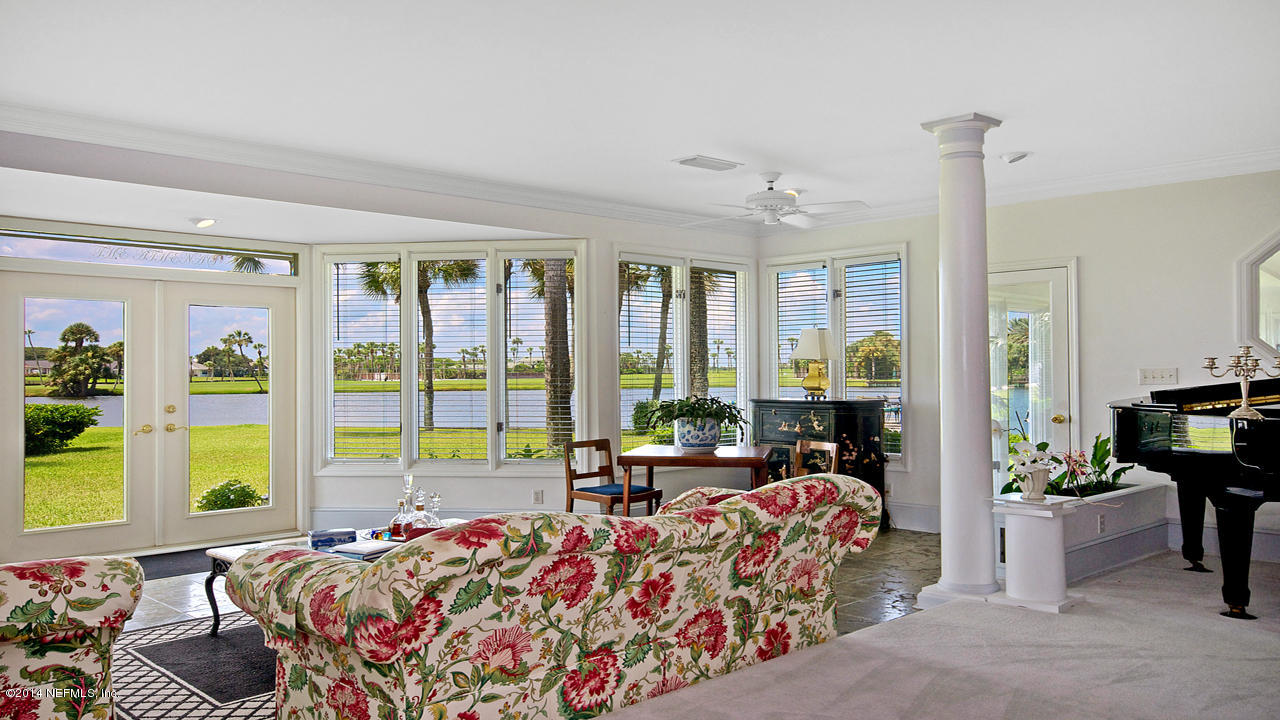 5 Solana Road Ponte Vedra Beach, FL 32082 - Photo 4 of 28 a bed room with a bed and a chair