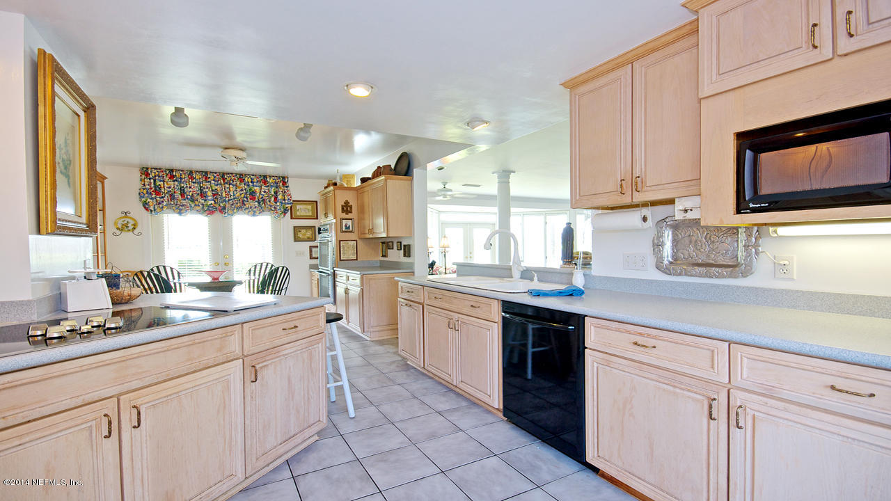 5 Solana Road Ponte Vedra Beach, FL 32082 - Photo 7 of 28 a kitchen with white cabinets and appliances