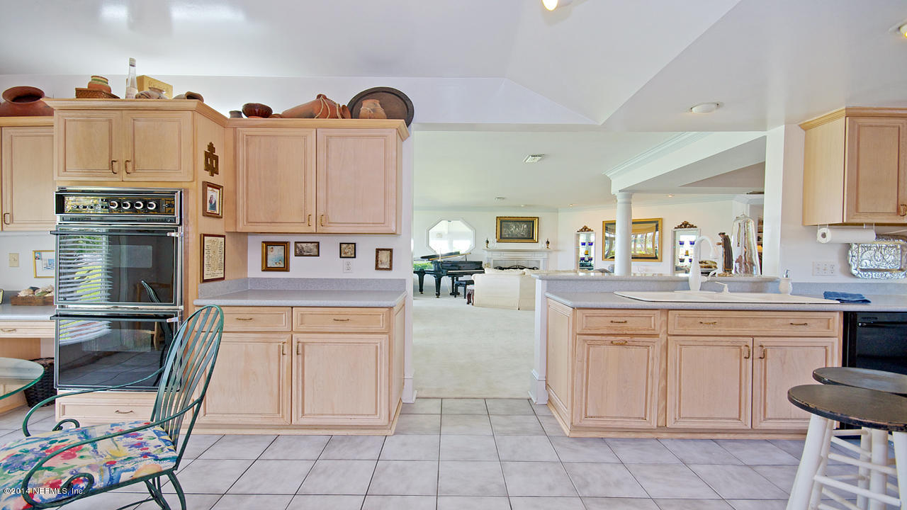 5 Solana Road Ponte Vedra Beach, FL 32082 - Photo 8 of 28 a kitchen with cabinets and chairs