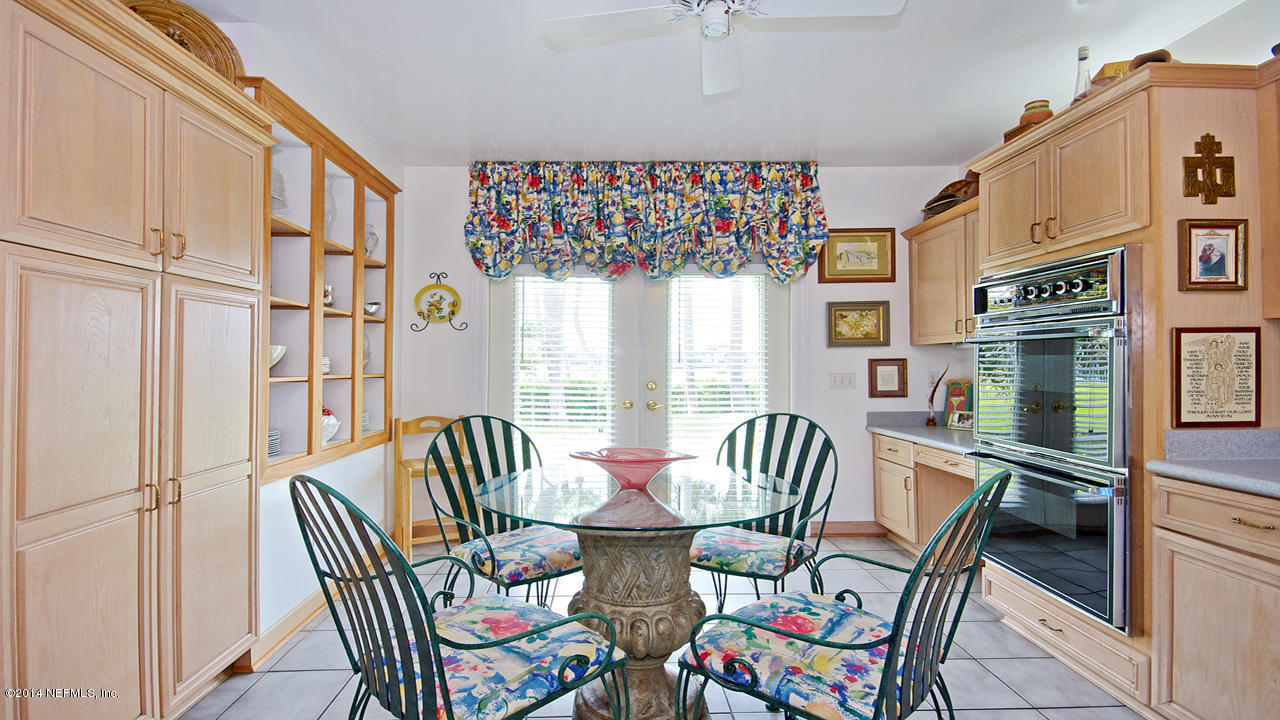 5 Solana Road Ponte Vedra Beach, FL 32082 - Photo 9 of 28 a view of a dining room with furniture a chandelier and wooden floor