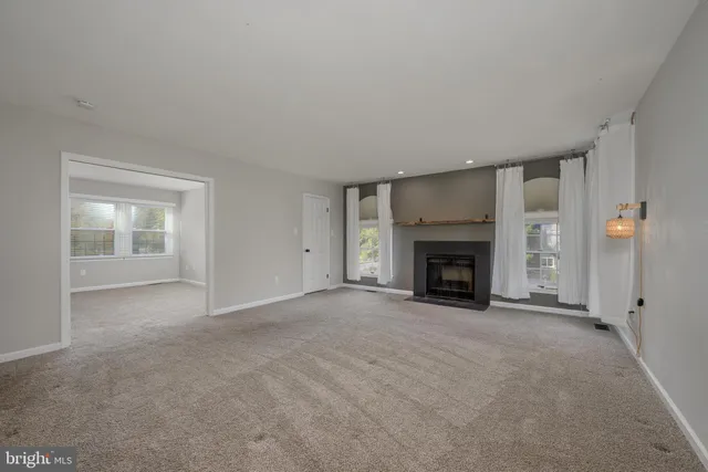 a view of an empty room and window