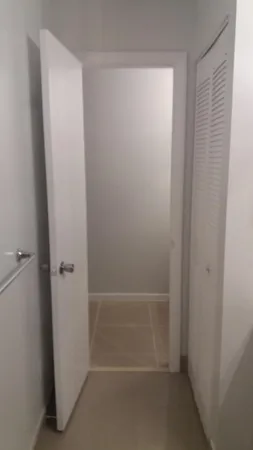 a view of an empty room with a window