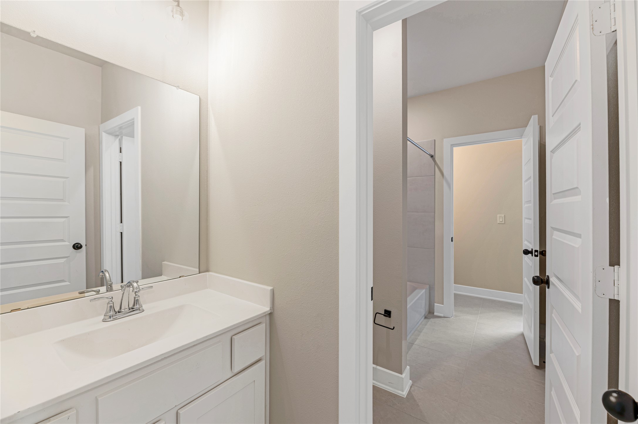 1508 Rodeo Ridge Drive Georgetown, TX 78628 - Photo 24 of 37 Full bathroom featuring vanity, shower / washtub combination, and light tile patterned floors