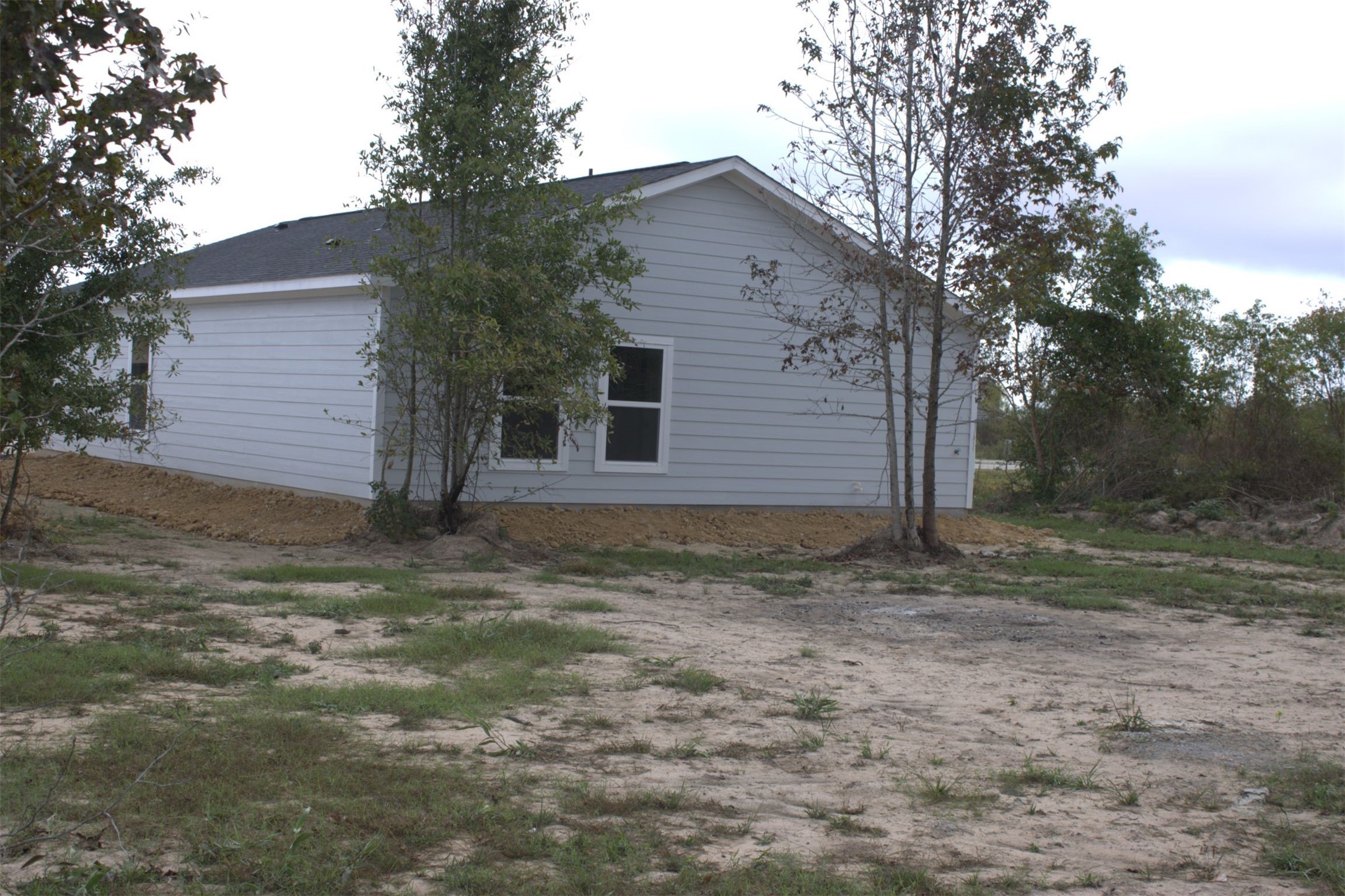 338 Road 5840 Cleveland, TX 77327 - Photo 12 of 12 a view of a house with a yard