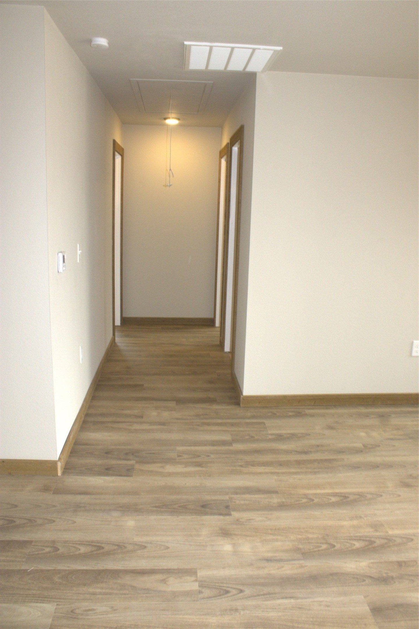 338 Road 5840 Cleveland, TX 77327 - Photo 9 of 12 a view of a hallway with wooden floor