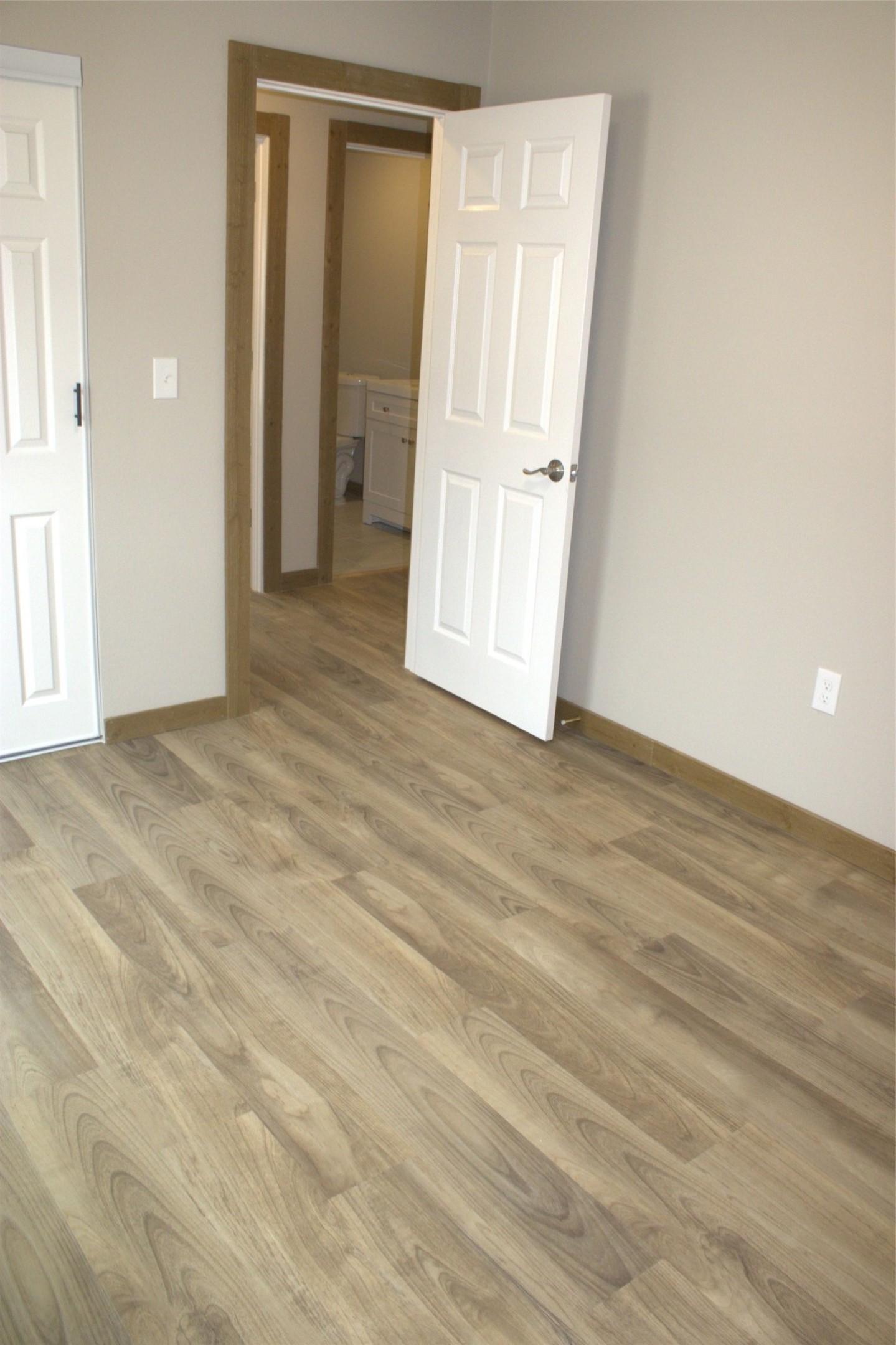 338 Road 5840 Cleveland, TX 77327 - Photo 10 of 12 a view of an empty room with wooden floor
