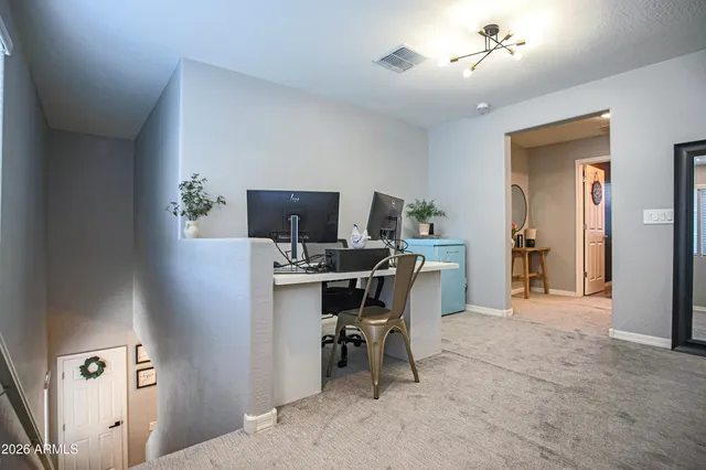 a living room with furniture and potted plant