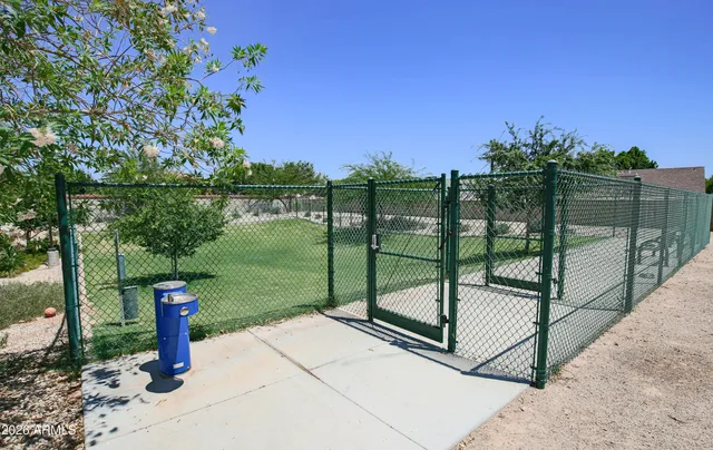 a view of outdoor space with swings and slides