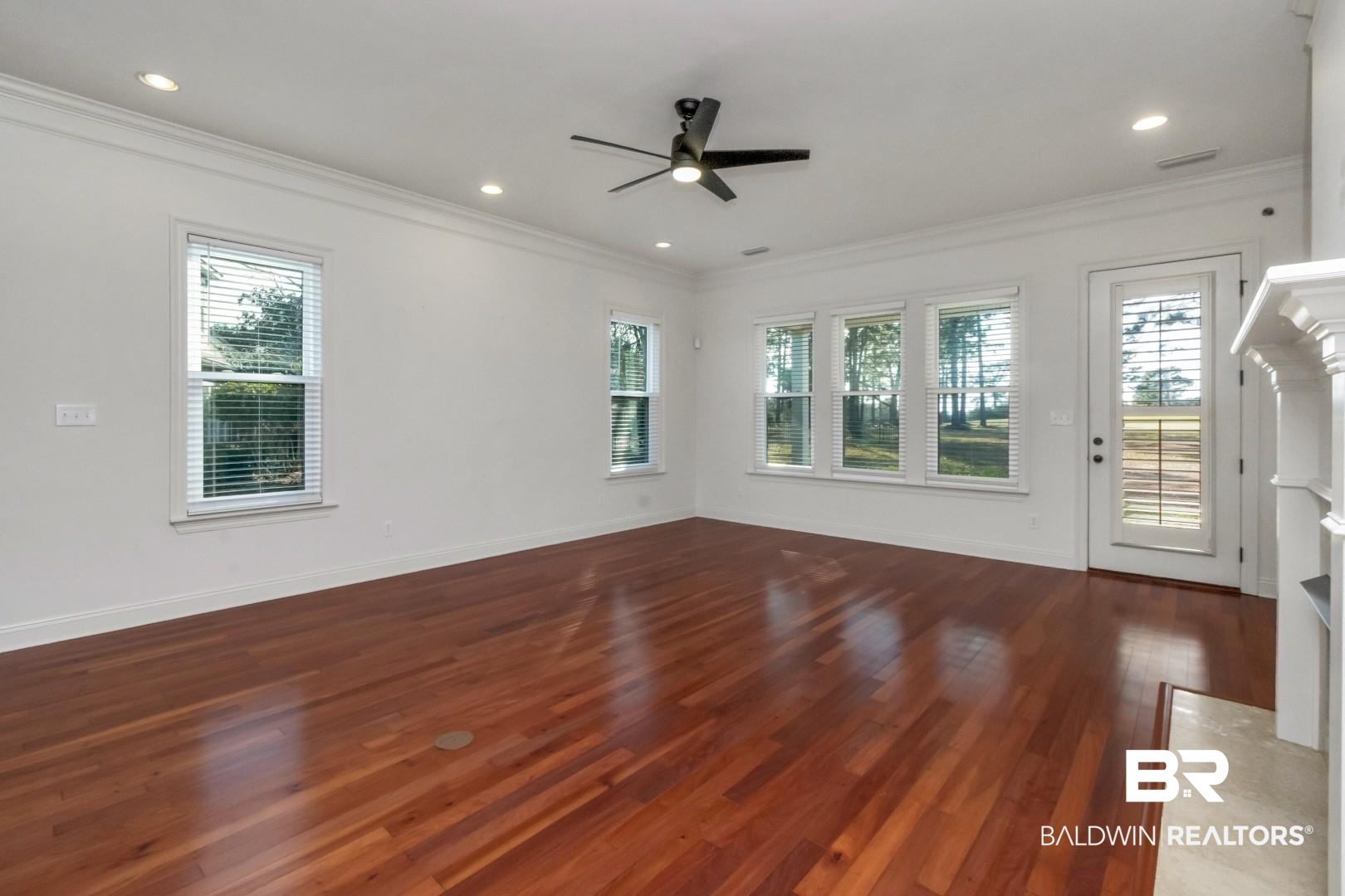 30585 Pine Court Daphne, AL 36527 - Photo 9 of 49 Spare room with crown molding, dark wood-style floors, ceiling fan, and recessed lighting