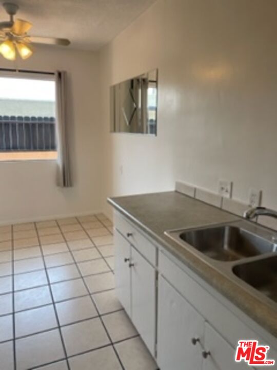 3739 McLaughlin Avenue Los Angeles, CA 90066 - Photo 10 of 11 a kitchen with a sink and cabinets